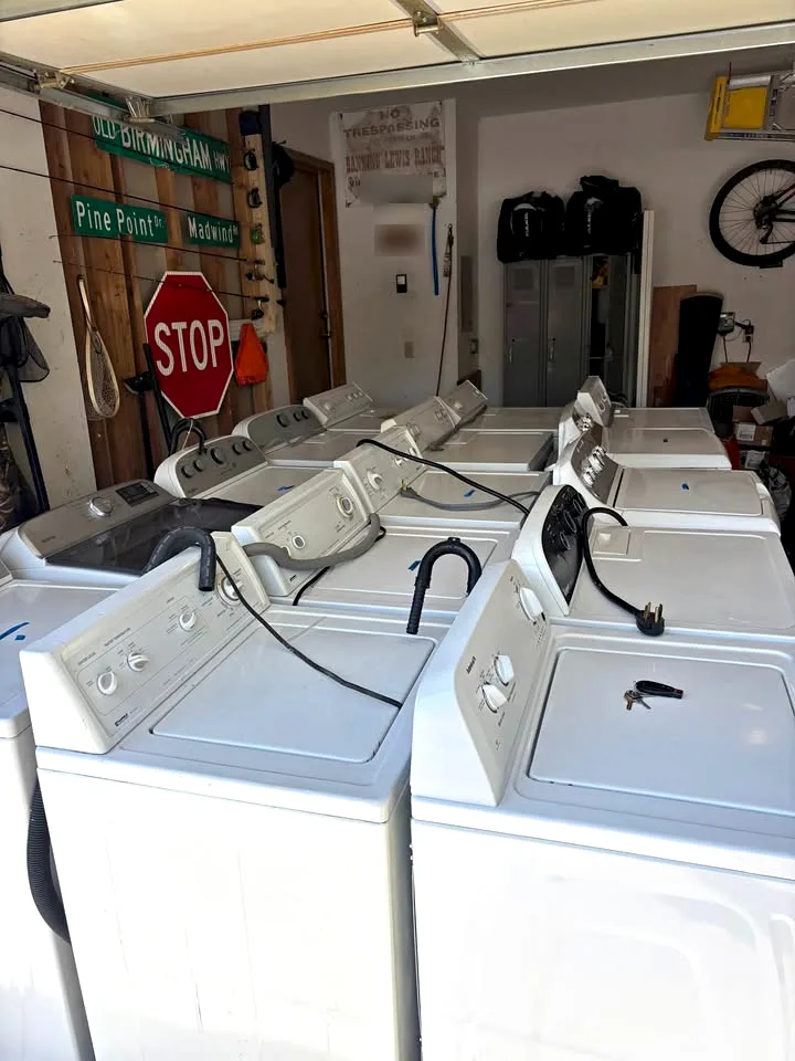 Rows of washers and dryers in a garage